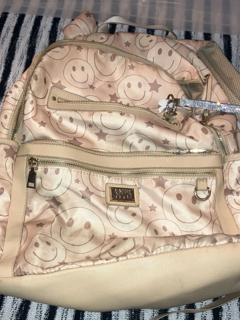 Madden NYC smiley faced back pack with gold hardware , beige & brown 9 pockets z